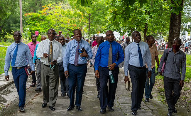 Haitian pastors walk around the STEP seminary, praying for the campus.